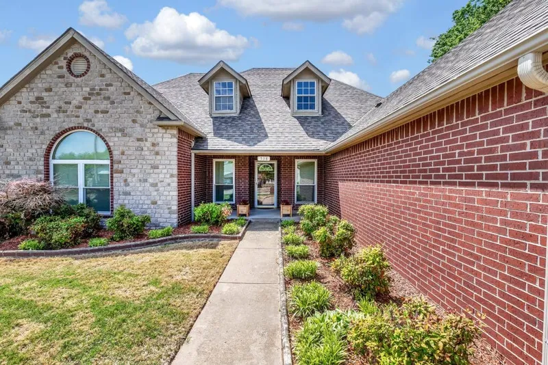 Best Window Co. replacement windows installed on a brick home